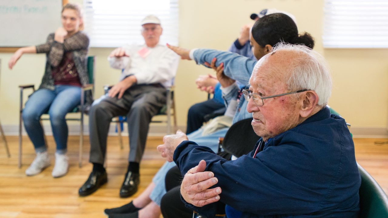 Toru Lura, stretches during the morning exercises at the WISE & Healthy Aging adult day service center for seniors with dementia in Santa Monica, California, in February 2016.