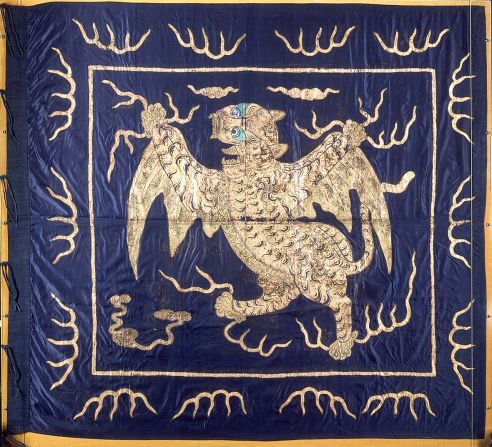 This ornate Imperial Chinese flag is made from silk and features a winged tiger crafted in gold foil. The mythical creature with wild green eyes holds flashes of lightning in its claws.<br />"In terms of aesthetics, this is probably my favorite flag in the collection," Davey says of the intricate textile, which is one of the few <a href="index.php?page=&url=http%3A%2F%2Fcollections.rmg.co.uk%2Fcollections%2Fobjects%2F559.html" target="_blank" target="_blank">now on display to the public.</a> "It was taken during the capture of Canton in 1857."  <br />