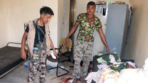 Yemeni pro-government fighters, loyal to exiled Yemeni President Abedrabbo Mansour Hadi, inspect an elderly care home in Yemen's main southern city of Aden after it was attacked by gunmen on March 4, 2016.
Four gunmen stormed the facility housing dozens in Aden's Sheikh Othman district, killing a guard before tying up and shooting employees, the officials told AFP.