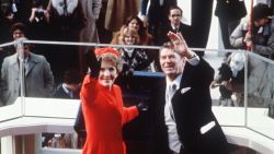 US President Ronald Reagan (C) salutes beside his wife Nancy Reagan after being sworn in as 40th President of the United States by Chief Justice Warren Burger during inaugural ceremony, on January 20, 1981 at the Capitol in Washington, DC. At right is vice-president George W. Bush. (Photo credit should read /AFP/Getty Images)