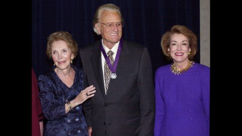 Reagan and Elizabeth Dole, right, pose with the Rev. Billy Graham after honoring him with the Ronald Reagan Freedom Award in recognition of his "monumental and lasting contribution to the cause of religious freedom" during a ceremony on April 5, 2000, in Beverly Hills, California.
