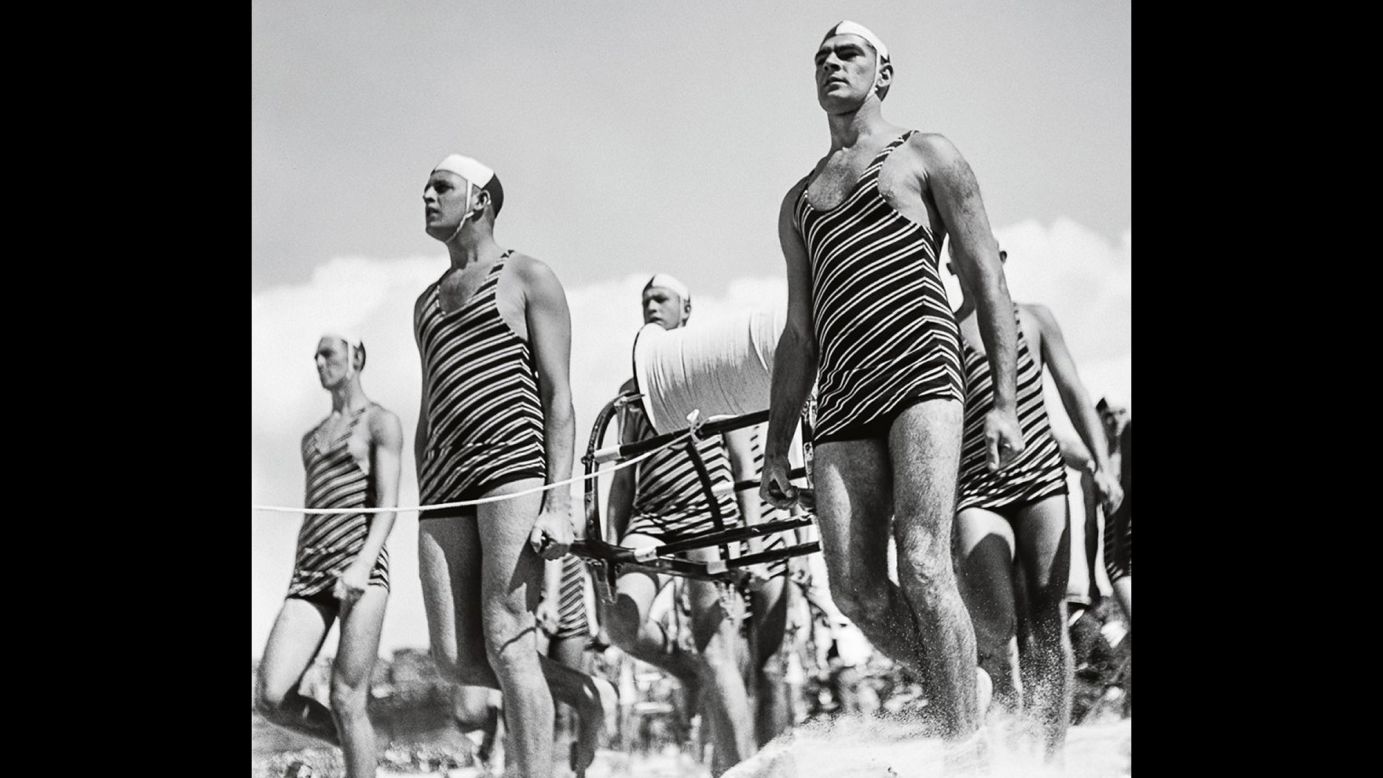 Lifeguards walk on Sydney's Bondi Beach around 1938. As an island nation with more than 22,000 miles of coastline, Australia needed an army of surf-savvy lifeguards to look after its citizens. The Surf Life Saving movement began in 1907 as an all-volunteer service.