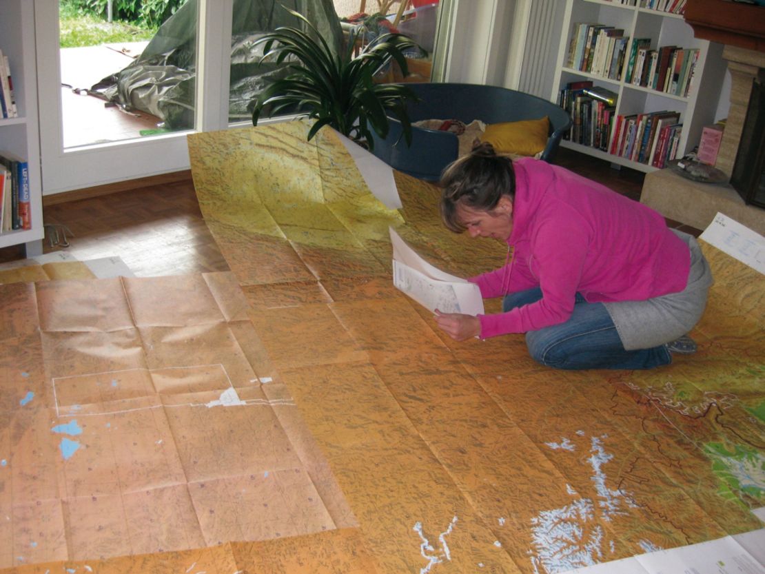 Marquis pored over maps in preparation for her journey. 