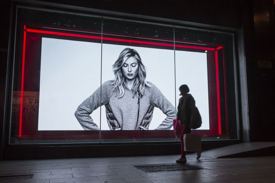 A shopper in Shanghai, China, walks past a Nike advertisement featuring Sharapova.