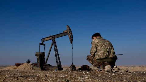 A Kurdish YPG fighter on guard at an oil pump close to al Hawl, which lies in north-eastern Syria between the Turkish and Iraqi borders. ISIS carries out frequent suicide attacks in the area.