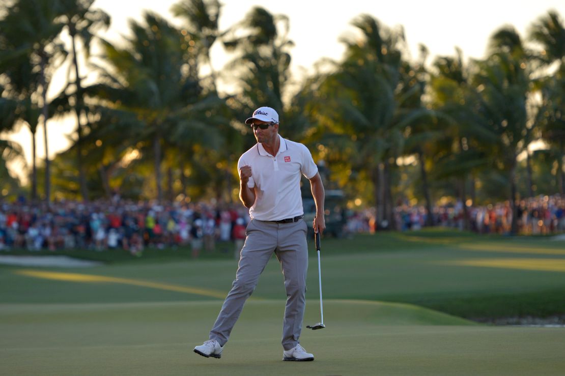 Scott celebrates after sinking the final and decisive putt to clinch the WGC-Cadillac Championship