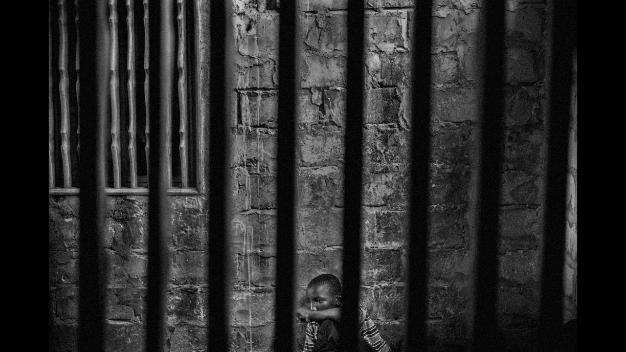 Abdoulaye, 15, is imprisoned at a Quranic school in Thies, Senegal, in May. The rooms have windows with security bars to keep the talibés, or students, from running away. Photographer Mario Cruz gained rare access to some corrupt Quranic schools in Senegal where students are being held against their will and forced to work for teachers.