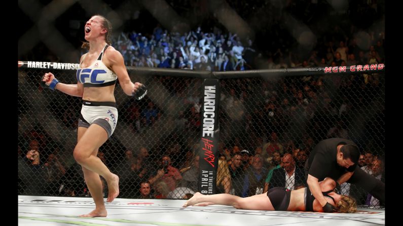 Miesha Tate celebrates after she defeated Holly Holm to win the UFC bantamweight title on Saturday, March 5. Holm submitted to a rear-naked choke in the fifth round.