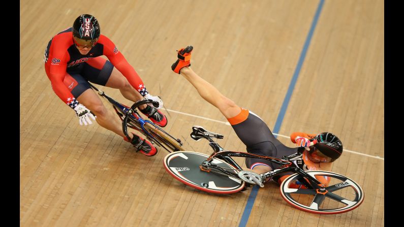 Dutch cyclist Matthijs Buchli, left, crashes into American Matthew Baranoski during a keirin race Sunday, March 6, at the Track Cycling World Championships.