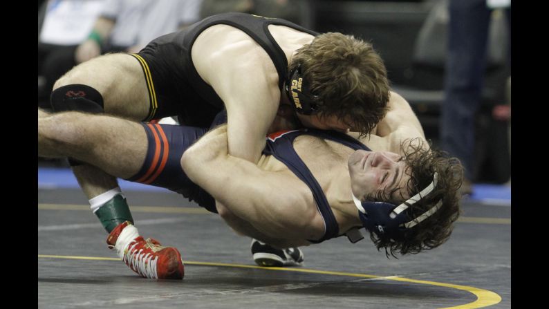 Illinois's Zane Richards, bottom, wrestles Iowa's Cory Clark during the Big Ten Championships on Sunday, March 6. Clark won the match and the 133-pound weight class.