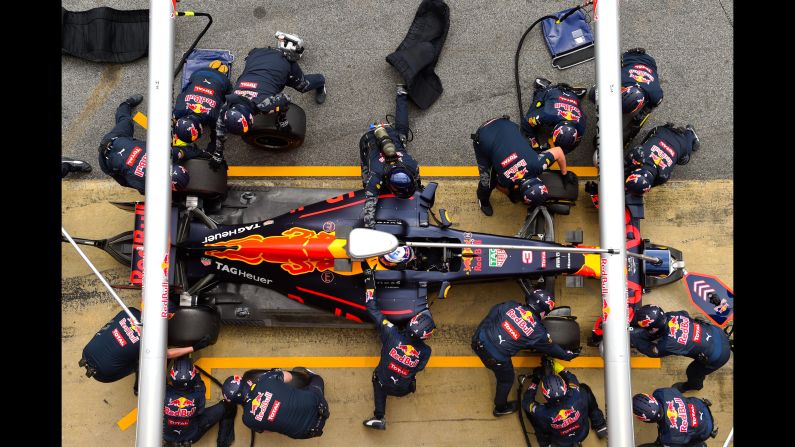 Members of the Red Bull Racing Team take part in a pit-stop practice session during winter testing in Montmelo, Spain, on Wednesday, March 2. The Formula One season begins in Australia on March 20.