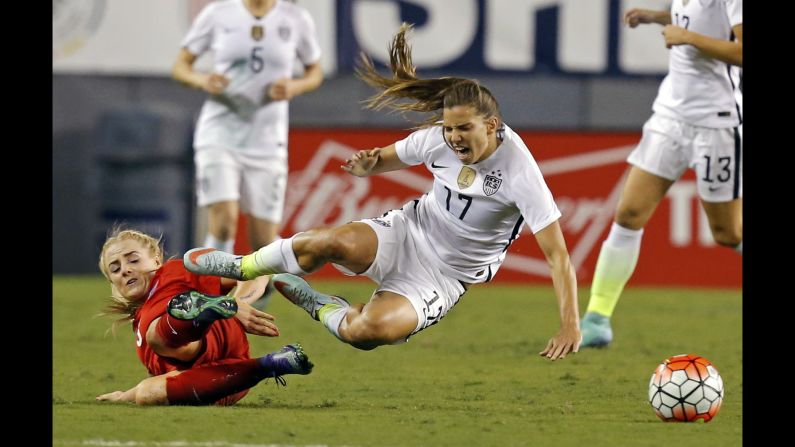 U.S. midfielder Tobin Heath reacts to a tackle by England's Alex Greenwood during a match in Tampa, Florida, on Thursday, March 3. The Americans won 1-0 in the SheBelieves Cup, a four-team tournament that ends March 9.