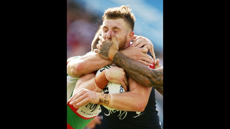 Jackson Hastings, a rugby player with the Sydney Roosters, is tackled by South Sydney Rabbitohs during a league match on Sunday, March 6.