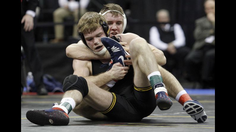 Penn State's Zain Retherford is wrapped around Iowa's Brandon Sorensen during the 149-pound final at the Big Ten Championships on Sunday, March 6. Retherford won the match and was named the conference's wrestler of the year.