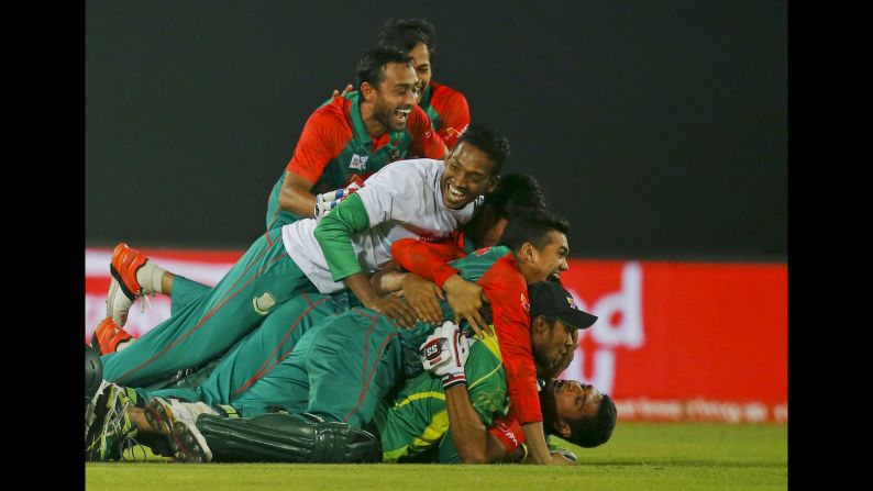 Bangladesh's cricket team celebrates after defeating Pakistan in the Asia Cup on Wednesday, March 2.