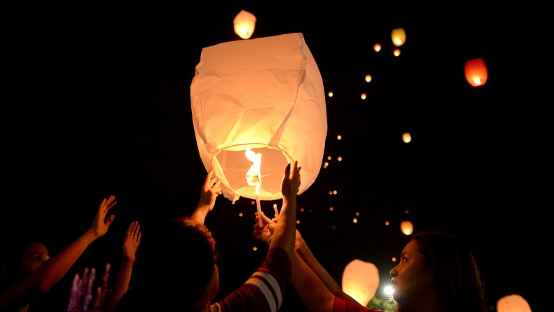 People in Manila release lanterns on Monday, March 7.