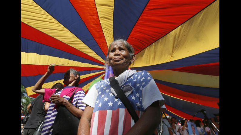 A protester wears an improvised American flag as she joins a rally in Manila, Philippines, on March 8.