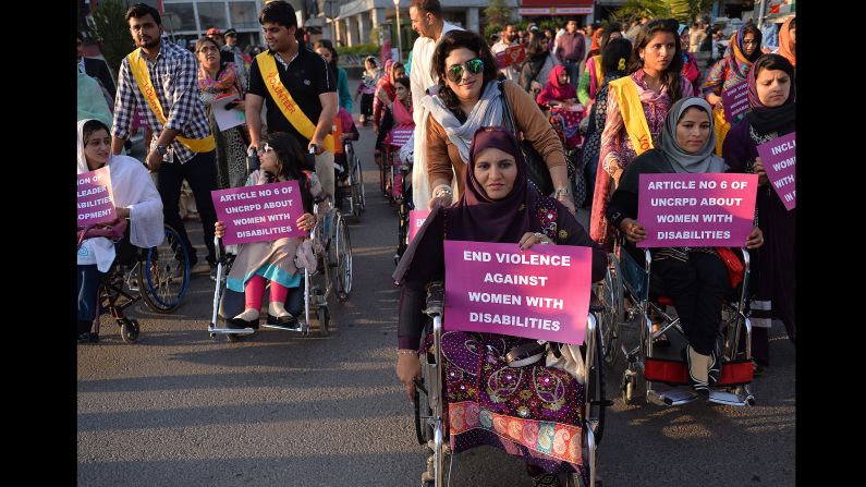Pakistani civil society activists hold placards as they march in a rally to mark International Women's Day in Islamabad on March 8.
