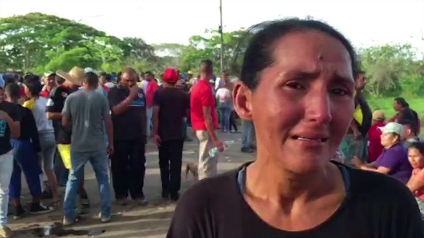 A mother weeps for her two missing daughters, hired to work for the missing miners. 
