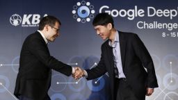 CEO of Google DeepMind, Demis Hassabis, left, shakes hands with South Korean professional Go player Lee Sedol during a press conference  on March 8 ahead of the Google DeepMind Challenge Match in Seoul. Lee Sedol and Google's artificial intelligence program, AlphaGo will play in a five game tournament from March 9 to March 15.