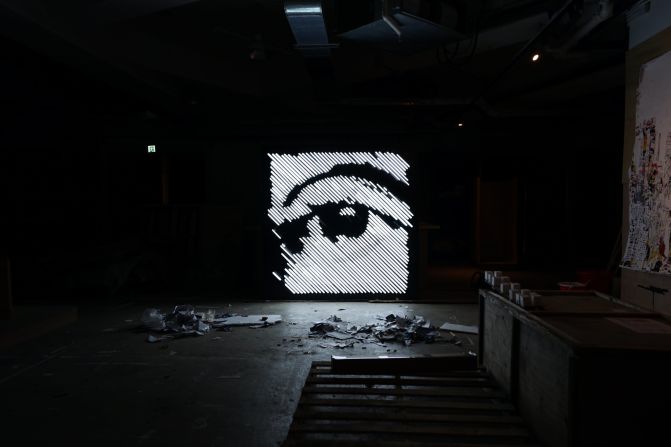 A work in progress, titled 'Glimpse,' in Vhils' studio in the Hong Kong industrial neighborhood of Aberdeen. The Debris exhibition marks his first experiments with neon lights, a material he has associated with the city since watching Wong Kar-wai films as a teenager. "Those who see it everyday don't recognize it's such a beautiful [medium] and taken to such an extreme in Hong Kong," says Farto.<br />