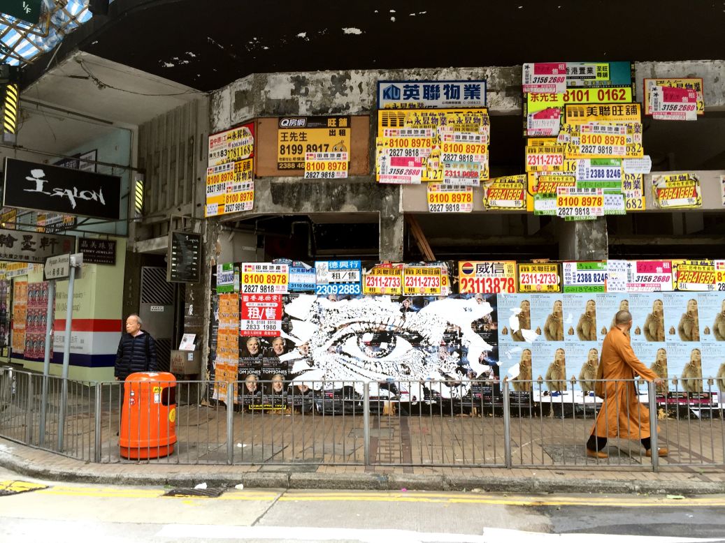 Vhils carved this striking image into a billboard on Hysan Avenue in Causeway Bay, a crowded Hong Kong commercial district, last year. The wall was quickly covered over by a fresh layer of advertisements, reflecting the fast pace of the city. 