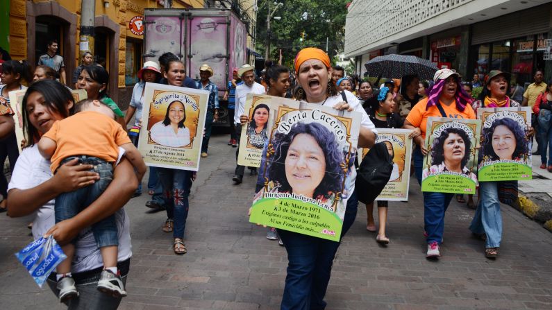 Marchers carry posters bearing the face of slain environmentalist Berta Caceres during a demonstration in Tegucigalpa, Honduras, on March 8. Caceres, a member of the Lenca indigenous group and co-founder of the Council of Indigenous Peoples of Honduras, led a successful campaign against one of Central America's biggest hydropower projects, the Agua Zarca cascade of four giant dams in the Gualcarque River basin. <a target="_blank">She was killed</a> on March 3.