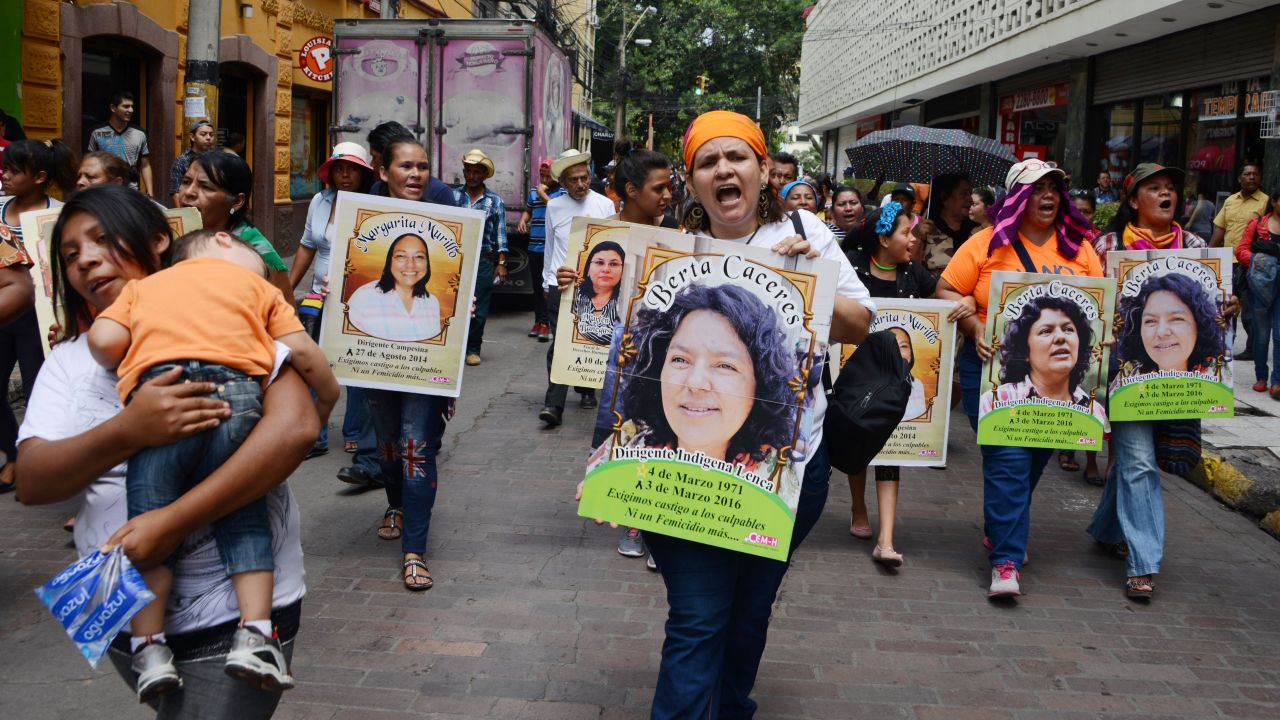 Protesters carried posters showing slain Honduran environmentalist Berta Cáceres at a demonstration in the country's capital. Activists have accused authorities of not doing enough to protect her. 