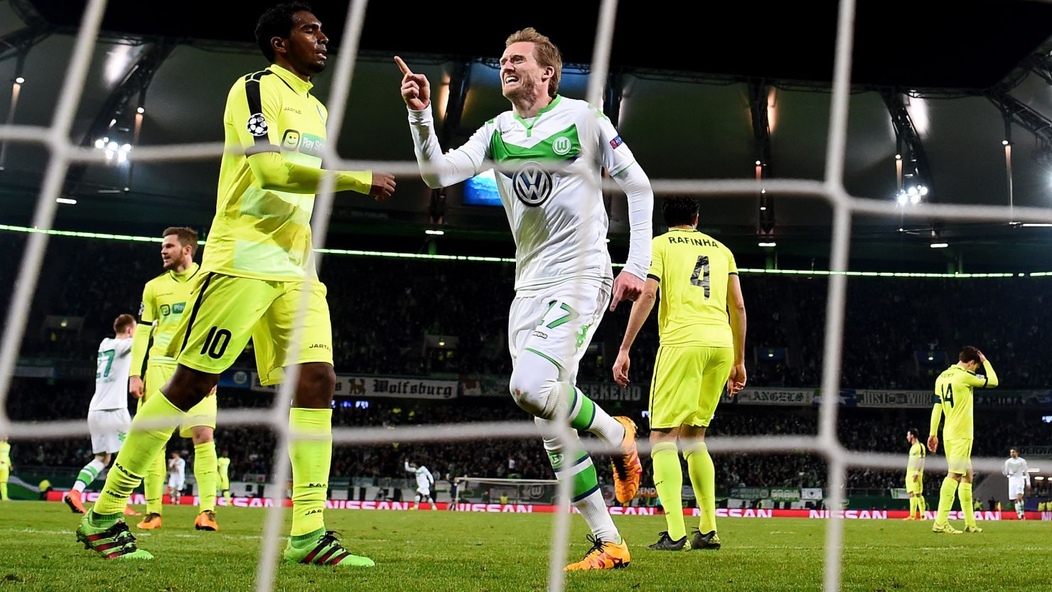 Andre Schurrle celebrates after scoring Wolfsburg's winner at home to Gent.