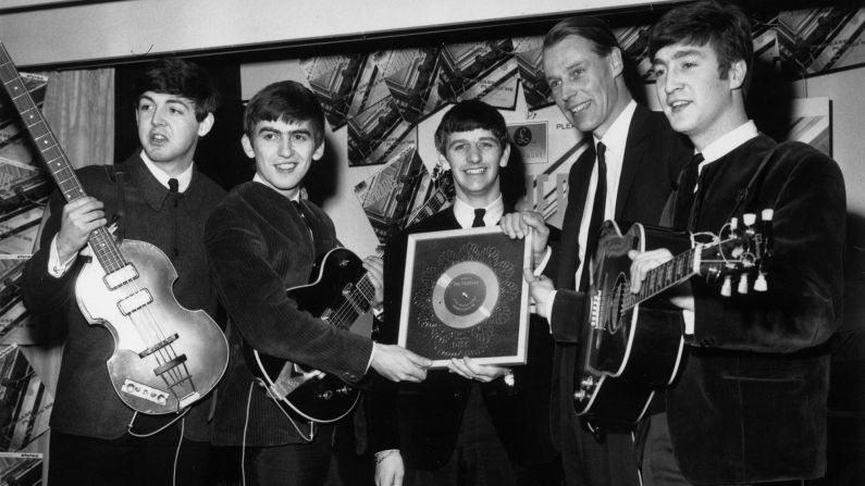 <a href="index.php?page=&url=http%3A%2F%2Fwww.cnn.com%2F2016%2F03%2F09%2Fentertainment%2Fgeorge-martin-obit%2Findex.html">Sir George Martin</a>, the music producer whose collaboration with the Beatles helped redraw the boundaries of popular music, died March 8, according to his management company. He was 90. Above, Martin poses with the Beatles after the album "Please Please Me" went silver in 1963.