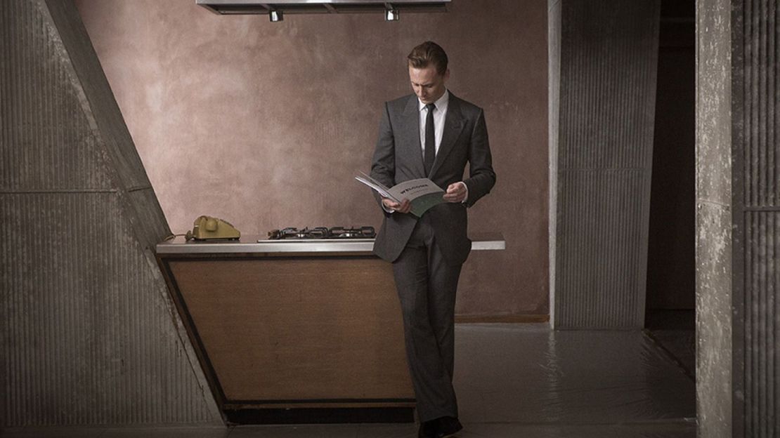 Dr Robert Laing (Tom Hiddleston) inspects his Brutalist apartment.