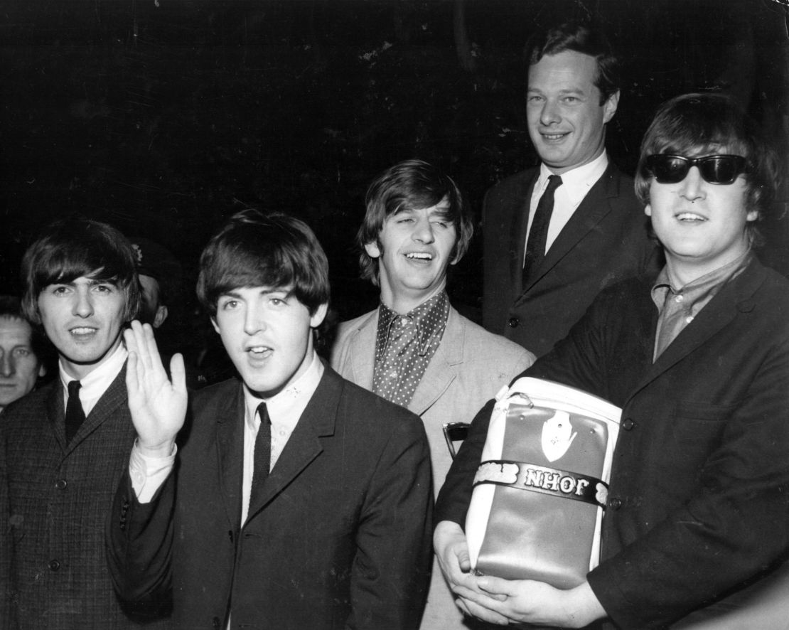 Epstein (second right) with the Fab Four in 1964. 