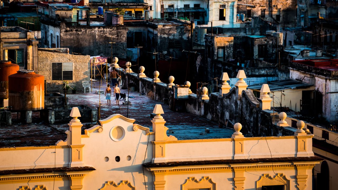 The sun sets on the rooftops of the Old City. Eighty percent of the buildings in Havana were constructed between 1900 and 1958, before the American embargo took effect. Many are now in urgent need of repair.