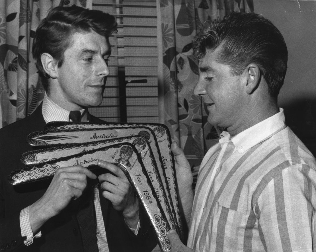 Derek Taylor (left) receives a set of  boomerangs during the group's 1964 Australian tour.  