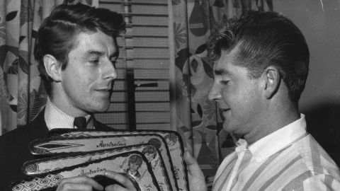 Derek Taylor (left) receives a set of boomerangs during the group's 1964 Australian tour.