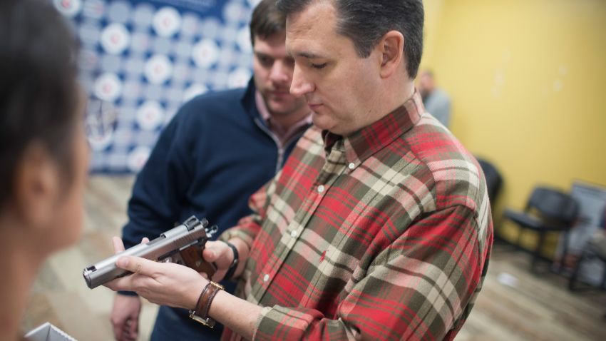 JOHNSTON, IA - DECEMBER 04:  Republican presidential candidate Sen. Ted Cruz (R-TX) looks over a handgun handed to him by a supporter during a campaign event at CrossRoads Shooting Sports gun shop and range on December 4, 2015 in Johnston, Iowa. A recent poll had Cruz tied for third place with Ben Carson and behind Sen. Marco Rubio (R-FL) and front runner Donald Trump in the race for the Republican presidential nomination.   (Photo by Scott Olson/Getty Images)