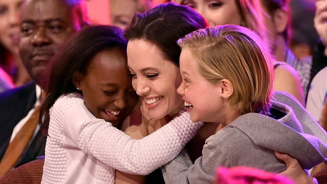 Actress Angelina Jolie hugs Zahara Marley Jolie-Pitt and Shiloh Nouvel Jolie-Pitt. The Jolie-Pitts children speak French as a second language at home.  