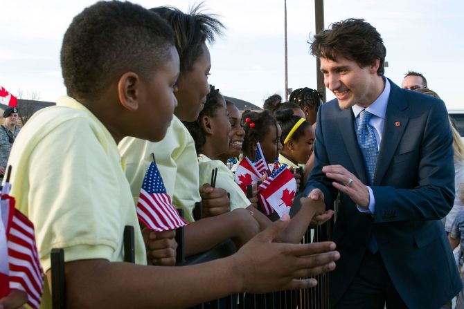 Trudeau greets students from Washington's Patterson Elementary School after he arrived at Andrews Air Force Base in Maryland on Wednesday, March 9.