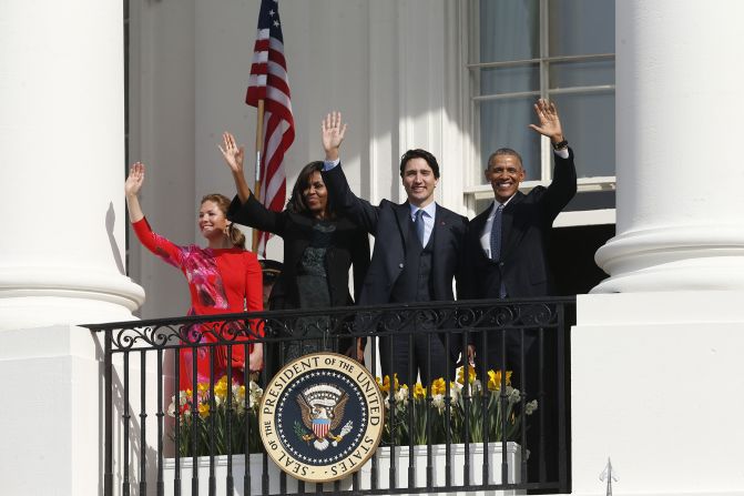 The couples wave from the White House balcony on March 10.