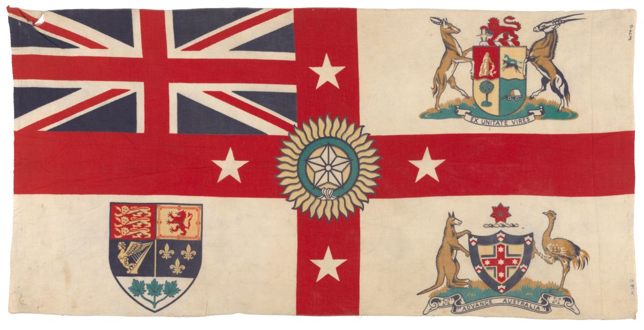 A 1920s version of Britain's White Ensign flag features the coat of arms of South Africa, Australia and Canada in the quarters, and the Star of India in the center. New Zealand is represented by four white stars on the red cross. <br />