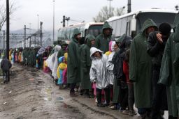 People line up for food near the Greek village of Idomeni the day after Macedonia sealed the border to migrants.