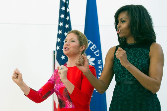 Michelle Obama and Sophie Gregoire-Trudeau sing with schoolchildren during a program at the U.S. Institute of Peace in Washington.