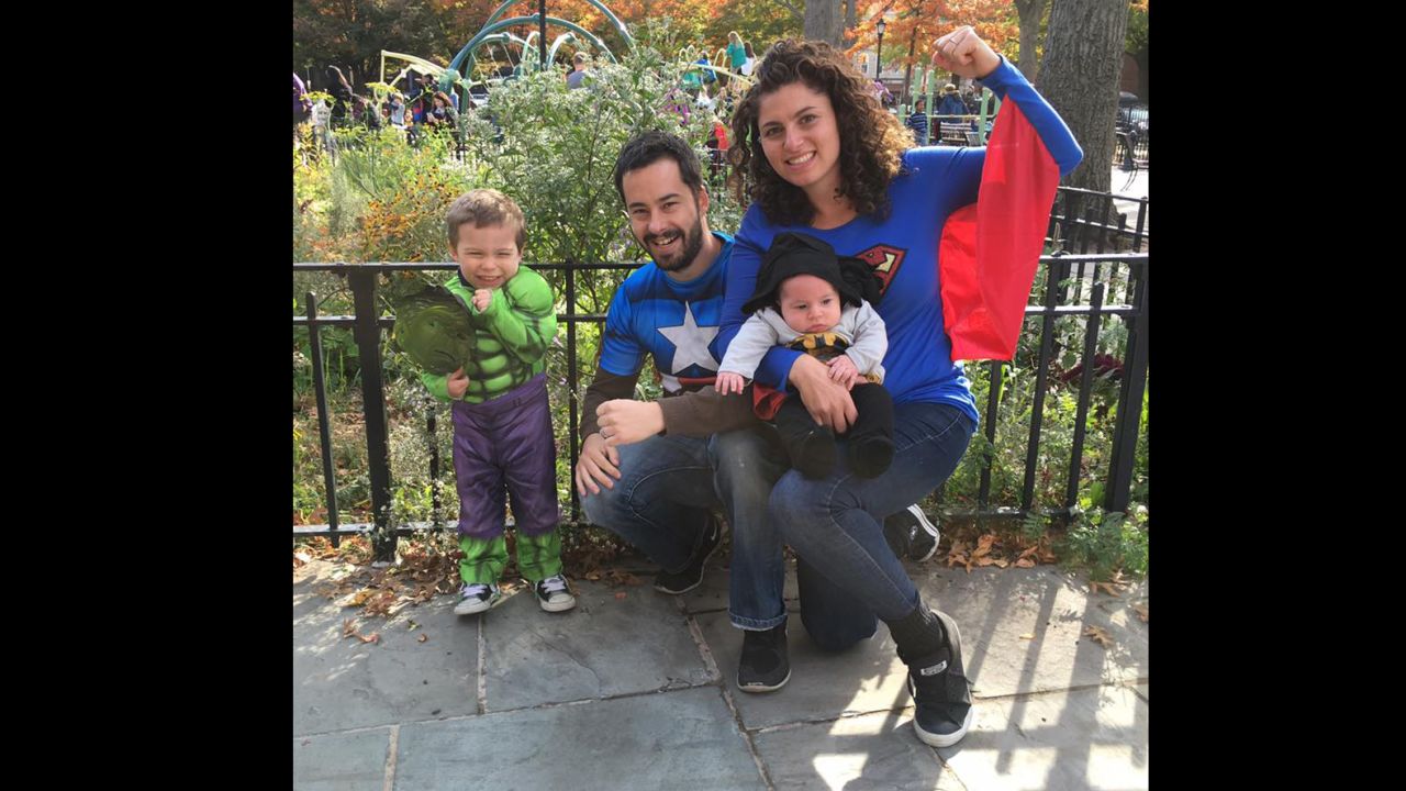 Raquel and Erwan Jegouzo pose as superheroes with their children.