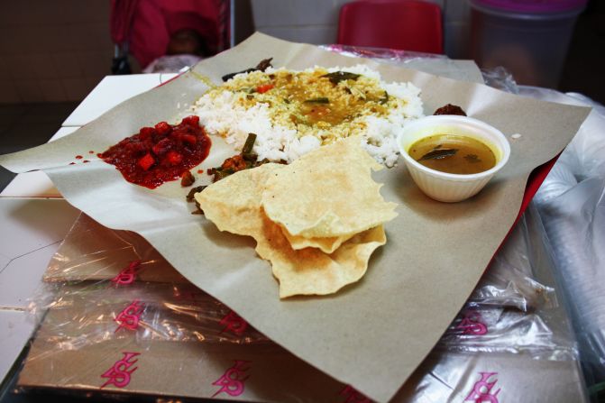 No frills means no frills. Curry, rice and popadoms are served on a piece of baking paper.