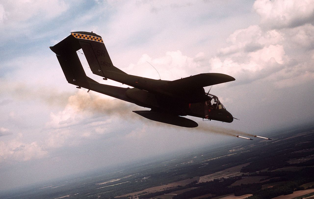 A 21st Tactical Air Support Squadron OV-10 Bronco aircraft fires white phosphorus rockets to mark a target for an air strike during tactical air control training. 