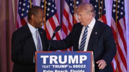 Republican presidential candidate Donald Trump stands with former presidential candidate Ben Carson as he receives his endorsement at the Mar-A-Lago Club on March 11, 2016 in Palm Beach, Florida. Presidential candidates continue to campaign before Florida's March 15th primary day.  (Photo by Joe Raedle/Getty Images)