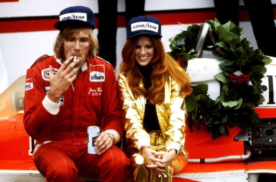 <strong>Photographer David Phipps share his images of James Hunt:</strong> Perched on his McLaren M26, James Hunt celebrates victory at the 1977 United States Grand Prix at Watkins Glen racetrack, New York. Hunt would often celebrate in playboy style -- with a cigarette, a beer, and a model by his side.