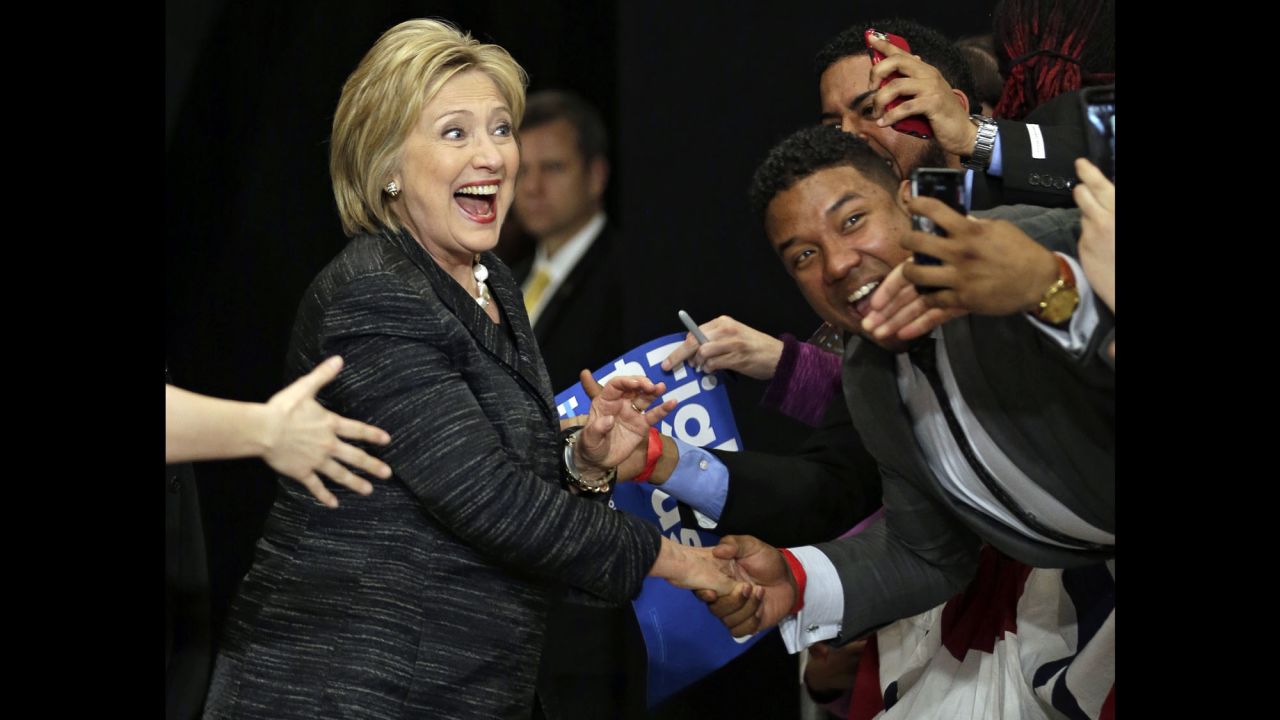 Democratic presidential candidate Hillary Clinton takes selfies with supporters before speaking during a rally at Cuyahoga Community College in Cleveland on Tuesday, March 8.