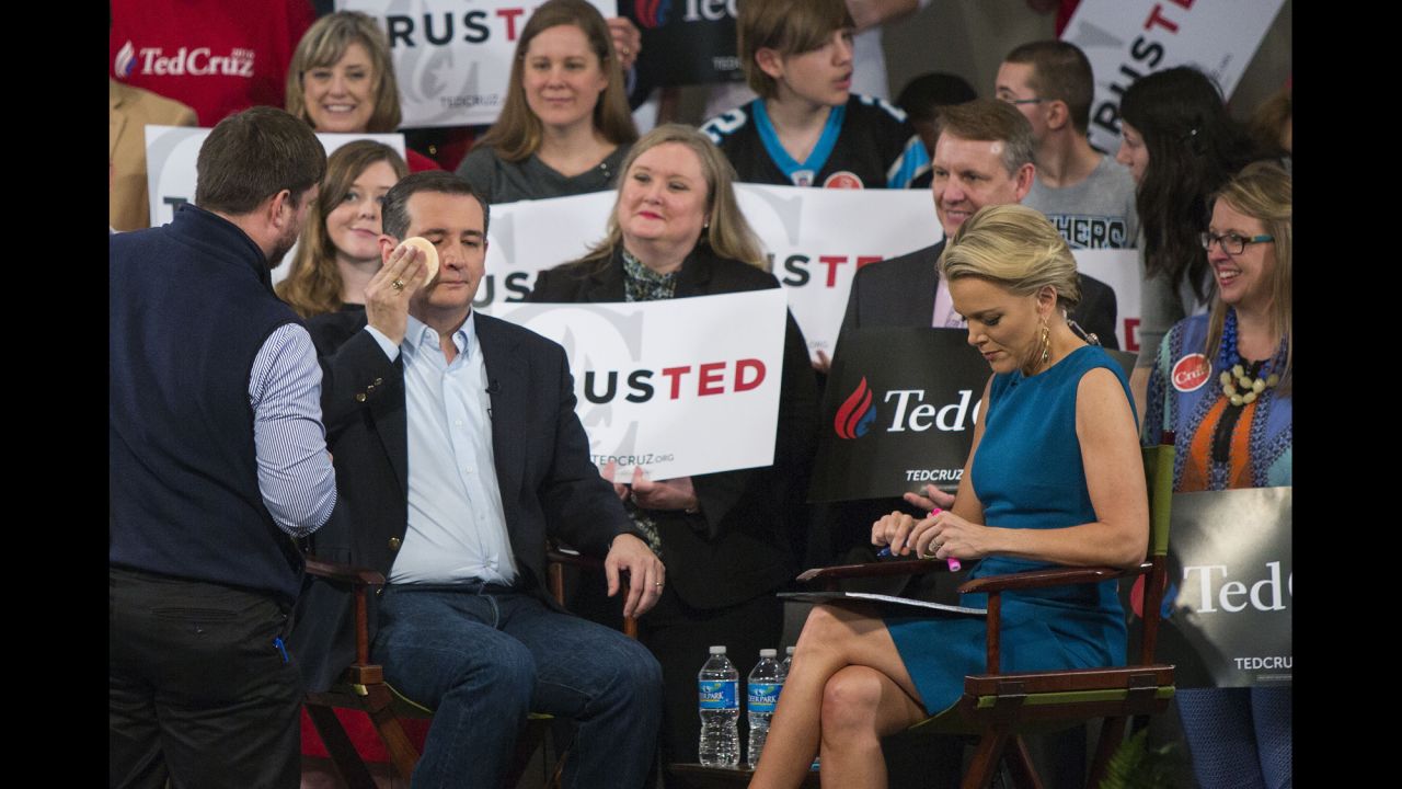 Republican presidential candidate Sen. Ted Cruz has makeup applied during a break at a town hall-style interview with Fox News host Megyn Kelly at Calvary Baptist Church in Raleigh, North Carolina,  on Tuesday, March 8. 