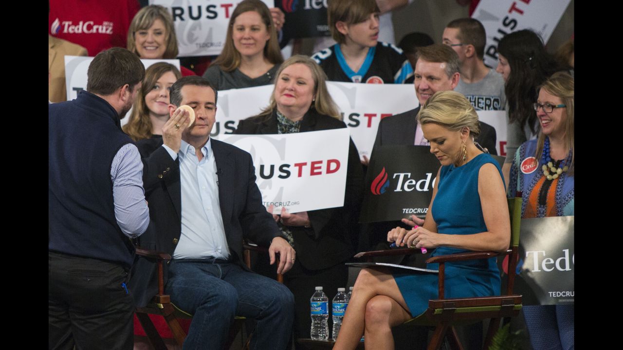 Republican presidential candidate Sen. Ted Cruz has makeup applied during a break at a town hall-style interview with Fox News host Megyn Kelly at Calvary Baptist Church in Raleigh, North Carolina, on Tuesday, March 8.